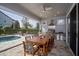 Outdoor patio with fully-equipped kitchen, dining area, fan, and view of the swimming pool at 15732 Shorebird Ln, Winter Garden, FL 34787