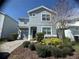 Charming two-story home with a landscaped yard and well-maintained exterior at 1580 Tempo Ln, Davenport, FL 33896