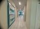 Bright hallway with tile flooring and artwork on display at 1580 Tempo Ln, Davenport, FL 33896