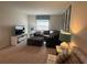 Cozy living room featuring comfortable seating, stylish decor, and ample natural light at 1580 Tempo Ln, Davenport, FL 33896