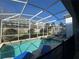 Private screened-in pool and spa with plenty of room to lounge in the Florida sunshine at 1580 Tempo Ln, Davenport, FL 33896