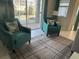 Relaxing sitting area with comfortable armchairs overlooking the pool at 1580 Tempo Ln, Davenport, FL 33896