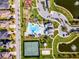 Aerial view of the community showing tennis courts, pool, clubhouse, playground, and ponds at 15863 Citrus Grove Loop, Winter Garden, FL 34787