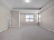 Spacious bedroom with natural light from many windows and neutral carpeting at 15863 Citrus Grove Loop, Winter Garden, FL 34787