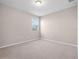 Bright bedroom with natural light and carpet features a single window at 15863 Citrus Grove Loop, Winter Garden, FL 34787