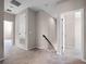 Open hallway with neutral carpet provides access to multiple bedrooms upstairs at 15863 Citrus Grove Loop, Winter Garden, FL 34787