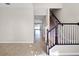 Hallway area featuring tile flooring and a staircase at 15863 Citrus Grove Loop, Winter Garden, FL 34787