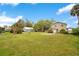 Spacious backyard with green grass and a detached building at 1604 Roosevelt Ave, Orlando, FL 32804