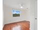 Bedroom with hardwood floors, closet, and a ceiling fan at 1604 Roosevelt Ave, Orlando, FL 32804