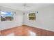 Cozy bedroom featuring hardwood floors and dual windows at 1604 Roosevelt Ave, Orlando, FL 32804