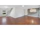 Open-concept living room with hardwood floors and natural light streaming through the windows at 1604 Roosevelt Ave, Orlando, FL 32804