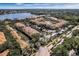 Aerial view of the community with beautiful landscaping, a lake, and well-maintained buildings at 1616 Legacy Park Dr # 1616, Maitland, FL 32751