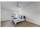 Serene bedroom with carpeted floors, natural light, ceiling fan, and a queen-size bed at 1616 Legacy Park Dr # 1616, Maitland, FL 32751