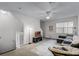 Inviting living room featuring a ceiling fan, carpeted floors, and an open staircase at 1616 Legacy Park Dr # 1616, Maitland, FL 32751