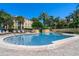 Community pool with lounge chairs and lush tropical landscaping, perfect for relaxation at 1616 Legacy Park Dr # 1616, Maitland, FL 32751
