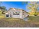 Exterior view of the house from the backyard showcasing the siding and windows at 1707 Gammon Ln, Orlando, FL 32811