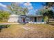 Charming single-story home featuring a quaint front porch and a well-manicured lawn at 1707 Gammon Ln, Orlando, FL 32811