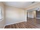 Spacious and well-lit living room features hardwood floors and neutral paint at 1707 Gammon Ln, Orlando, FL 32811