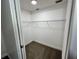 A view inside of a walk-in closet with carpeted floors and wire shelving for optimal storage at 1712 Lake Lorine Dr, Orlando, FL 32808