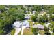 Aerial shot of a home with a lush backyard, surrounded by mature trees at 2243 Davis Dr, New Smyrna Beach, FL 32168