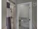 Bathroom featuring a tiled shower room and a doorway leading to a vanity and a bathtub at 2243 Davis Dr, New Smyrna Beach, FL 32168