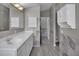 Bathroom with a wide vanity countertop and a mirror cabinet to provide more storage space at 2243 Davis Dr, New Smyrna Beach, FL 32168