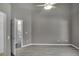 View of an empty bedroom with neutral walls and floors, ceiling fan and white door frames at 2243 Davis Dr, New Smyrna Beach, FL 32168
