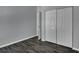 Cozy bedroom features hardwood floors, closet space, and neutral paint at 2243 Davis Dr, New Smyrna Beach, FL 32168