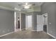 Spacious main bedroom with a ceiling fan, walk in closet and ensuite bath access at 2243 Davis Dr, New Smyrna Beach, FL 32168