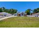 Home with beautiful landscaping, and ample parking space on a sunny day at 2243 Davis Dr, New Smyrna Beach, FL 32168