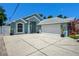 Home with beautiful landscaping, and ample parking space on a sunny day at 2243 Davis Dr, New Smyrna Beach, FL 32168