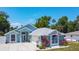 Charming single-Gathering home with a well-manicured lawn, a spacious driveway, and beautiful landscaping at 2243 Davis Dr, New Smyrna Beach, FL 32168