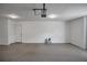 Spacious garage with smooth flooring, ample lighting and an automatic door at 2243 Davis Dr, New Smyrna Beach, FL 32168