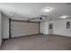 Bright, spacious garage featuring a smooth floor and an automatic door at 2243 Davis Dr, New Smyrna Beach, FL 32168