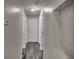 Neutral-toned hallway with attractive dark-wood laminate flooring and inset display shelves at 2243 Davis Dr, New Smyrna Beach, FL 32168