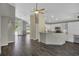 Open-concept kitchen features a breakfast bar, modern appliances, and ample cabinet space at 2243 Davis Dr, New Smyrna Beach, FL 32168