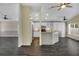 Bright kitchen with white cabinetry, stainless steel appliances, and a functional breakfast bar at 2243 Davis Dr, New Smyrna Beach, FL 32168