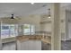 Bright open kitchen featuring granite countertops, white cabinets, and stainless steel appliances at 2243 Davis Dr, New Smyrna Beach, FL 32168