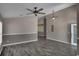 This living room features two-tone paint, modern flooring and ceiling fans at 2243 Davis Dr, New Smyrna Beach, FL 32168