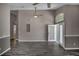 Spacious living room with new flooring, modern paint, and arch window at 2243 Davis Dr, New Smyrna Beach, FL 32168