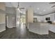 Spacious living area leads to the kitchen and a bright sunroom; perfect for entertaining at 2243 Davis Dr, New Smyrna Beach, FL 32168