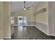 Open living room with stylish flooring, neutral tones, and natural light from french doors at 2243 Davis Dr, New Smyrna Beach, FL 32168