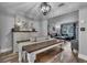 Open concept dining room showcasing hardwood floors and seamless flow to the living area at 2503 Lassek Dr, Orlando, FL 32806