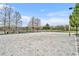 Sandy beach volleyball court with net, set against a picturesque natural backdrop and blue sky at 2602 Lodi Cir # 105, Kissimmee, FL 34746