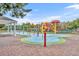 Fun community splash pad area with colorful play structures and a soft, padded ground surface for children to enjoy at 2611 Gala N Rd # 105, Kissimmee, FL 34746