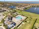 Beautiful community featuring a swimming pool, playground, and basketball court overlooking a picturesque lake at 2613 Mead Ave, St Cloud, FL 34771