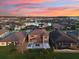 Aerial view of backyard with patio, hammocks, firepit and lake sunset at 2613 Mead Ave, St Cloud, FL 34771