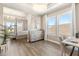 Bedroom and office combination featuring hardwood floors, a tray ceiling, and natural light at 2613 Mead Ave, St Cloud, FL 34771