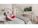 Comfortable bedroom featuring neutral colors, lots of light, and a modern dresser at 2613 Mead Ave, St Cloud, FL 34771