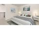 Bedroom showcasing neutral decor, soft carpet, and serene artwork for a relaxing atmosphere at 2613 Mead Ave, St Cloud, FL 34771